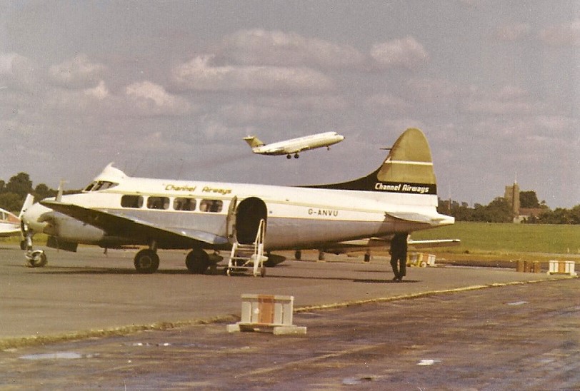 Channel Airways' G-AVGP blasting off from Runway 06 with their long serving Dove G-ANVU in the foreground. Photo by Neil Punnett.