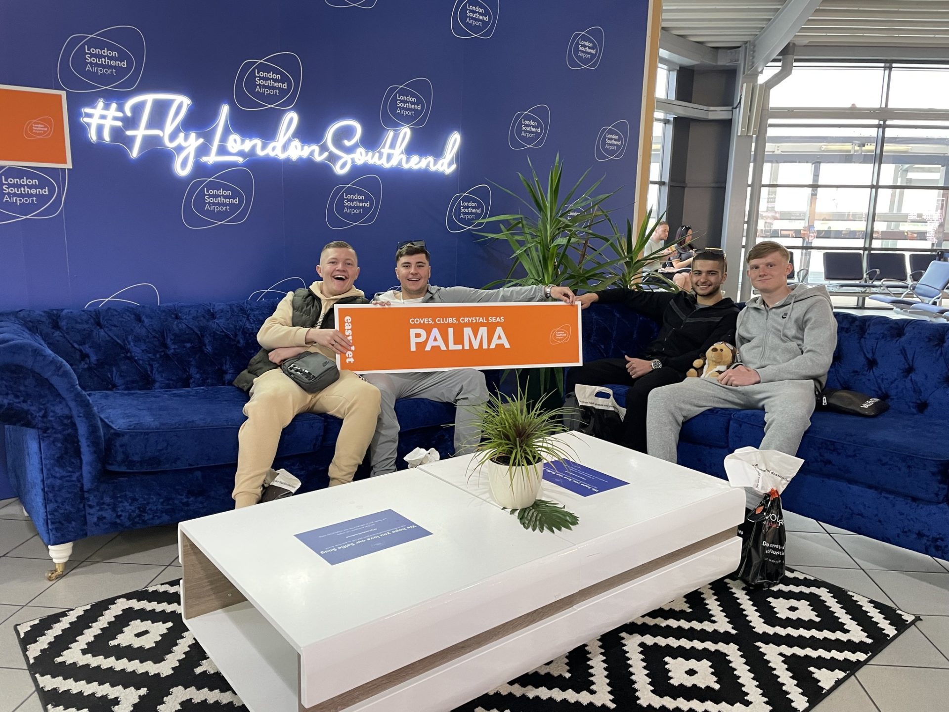 A group of passengers celebrating the launch of flights to Palma de Mallorca at The Snug, in the Departures Lounge at London Southend Airport