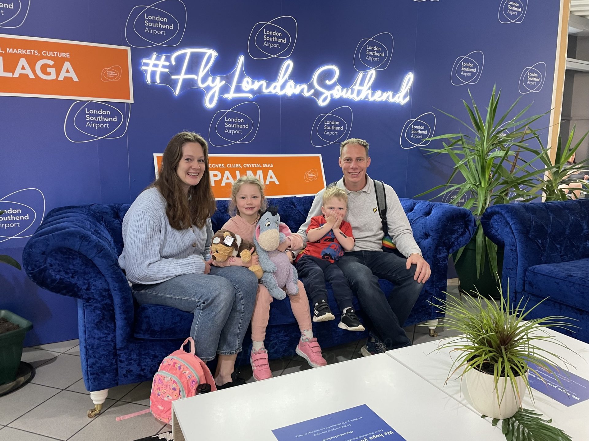 A family of passengers celebrating the launch of flights to Palma de Mallorca at The Snug, in the Departures Lounge at London Southend Airport