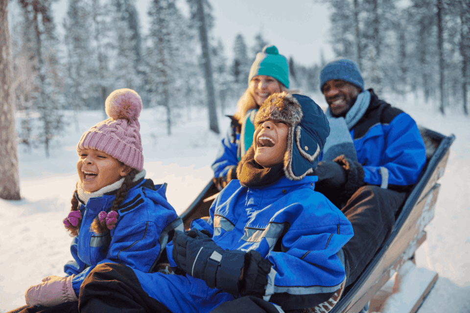 Close up of family sleigh ride in Lapland