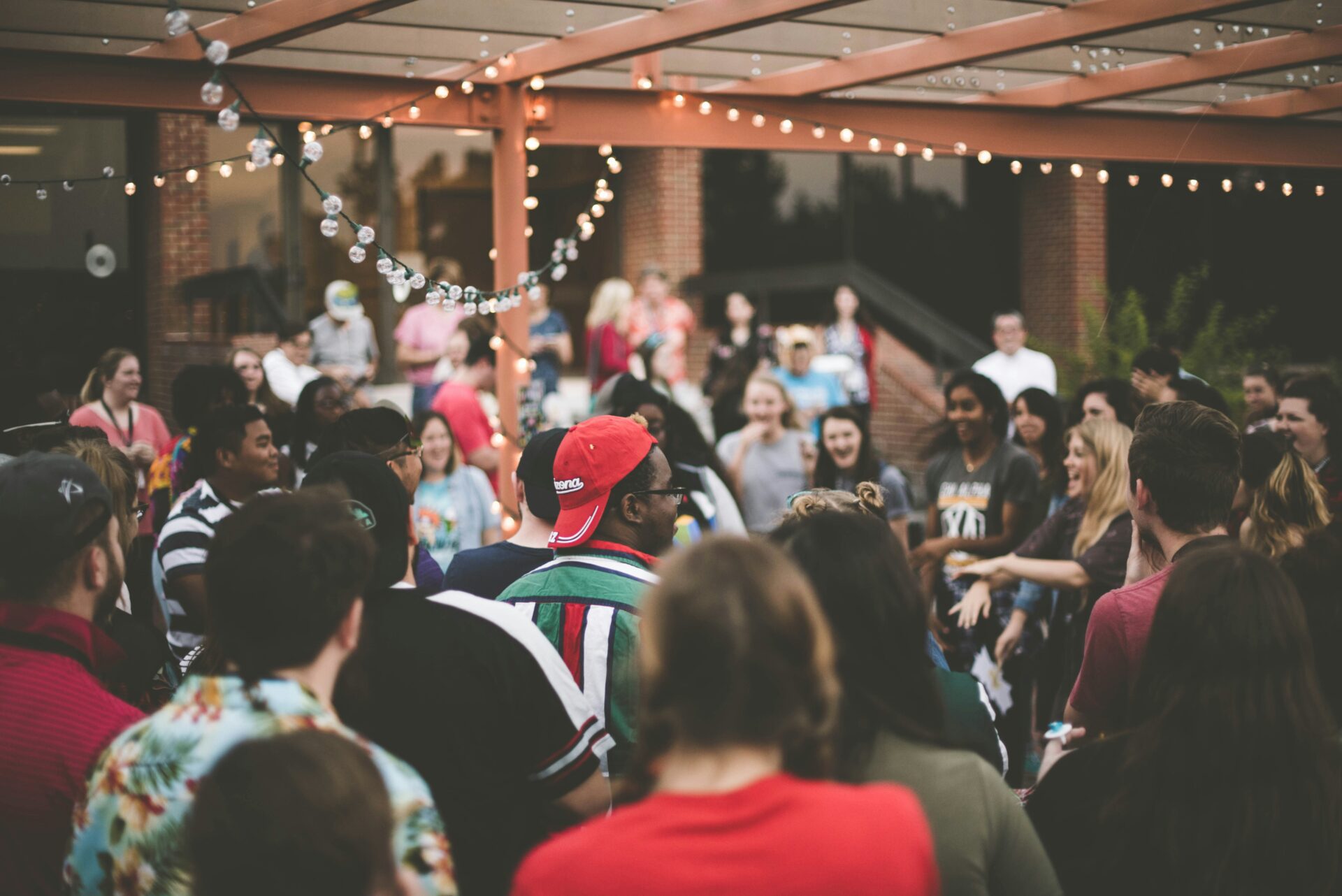 An image of people gathered in the street dancing together.