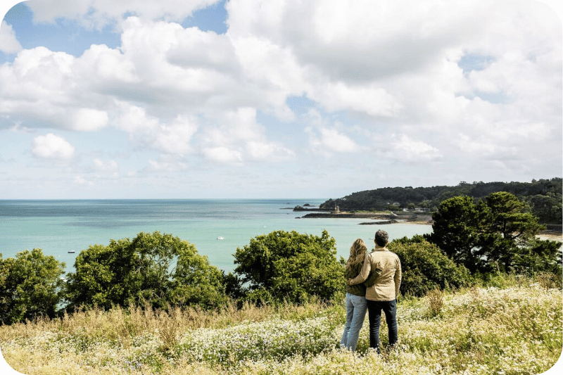 Couple walking in St Catherines, Jersey